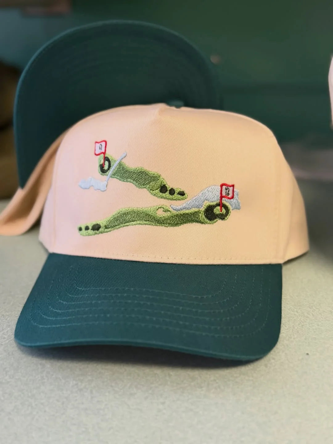 Close-up of a cream and green bachelor-party cap
