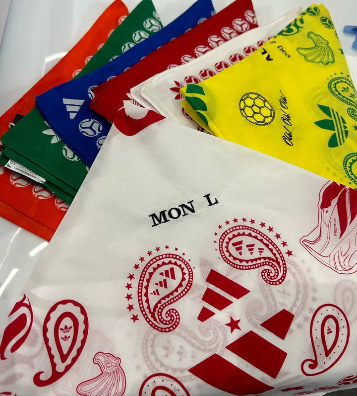 A fan of bandanas embroidered live with names at a retail activation