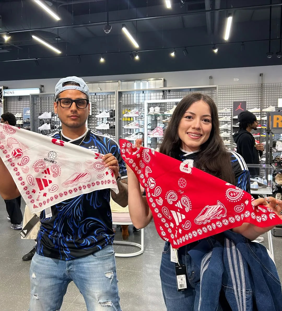 Two guests holding their finished bandanas