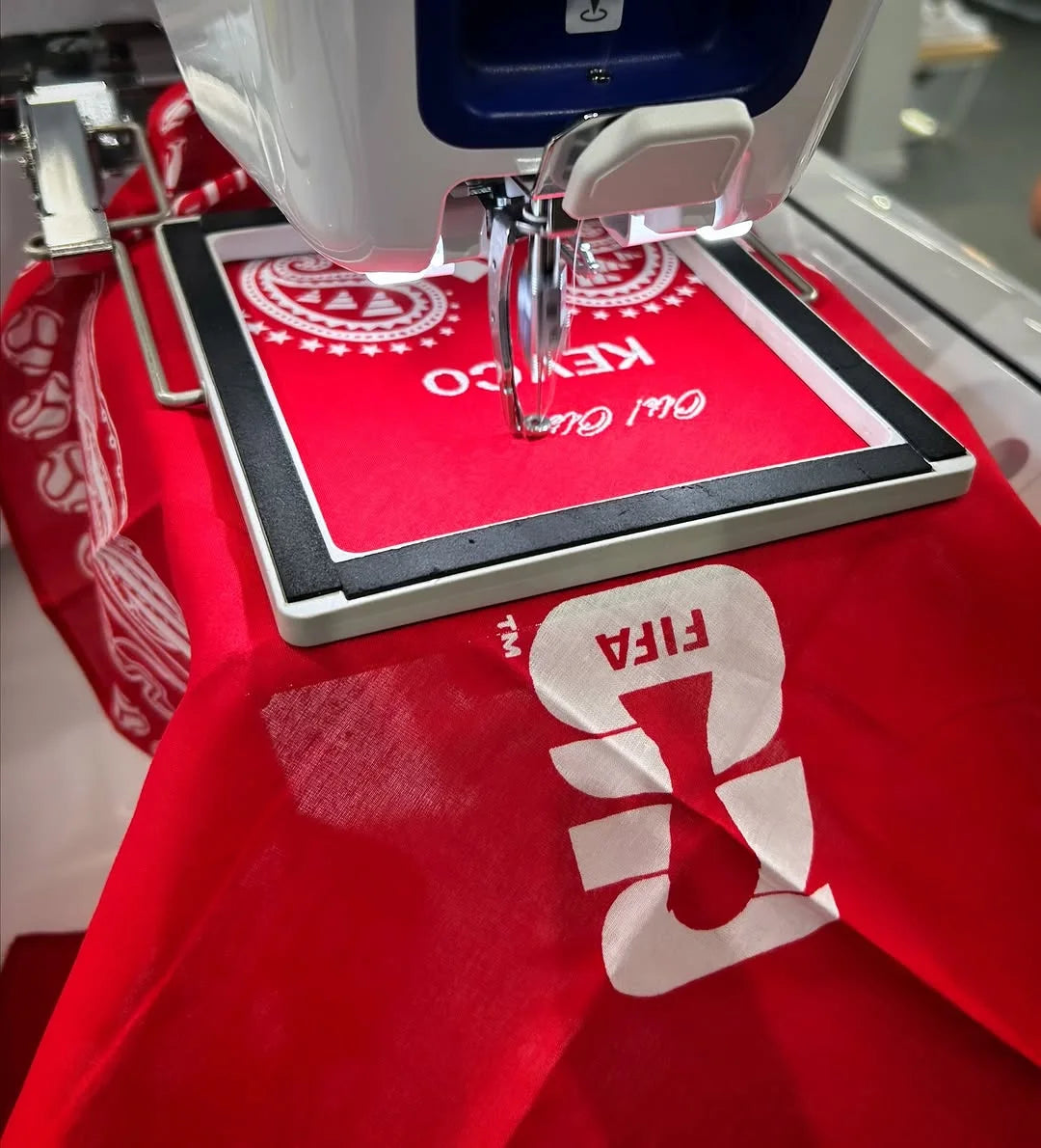 A bandana under the embroidery needle