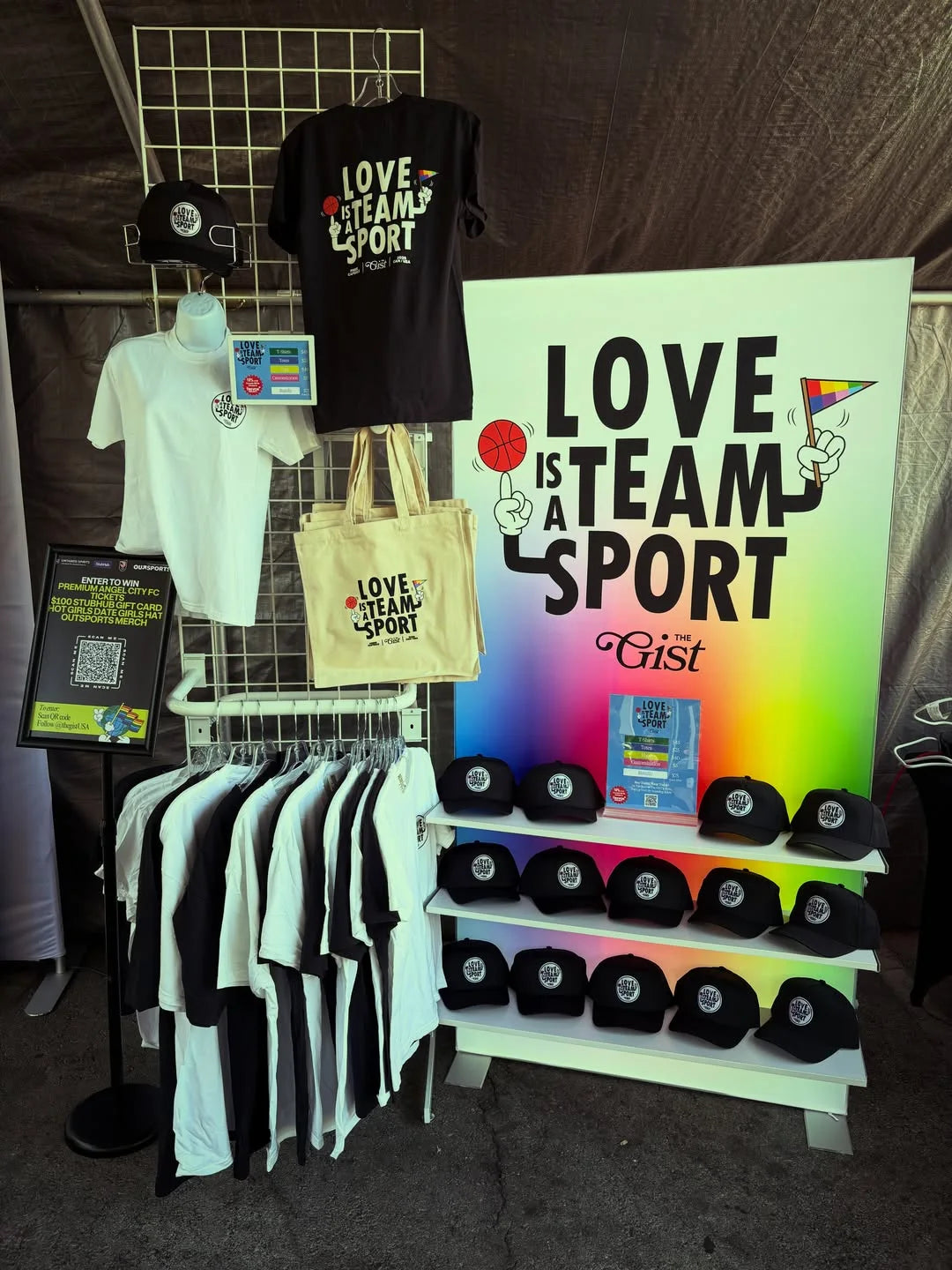 “Love is a Team Sport” merch display