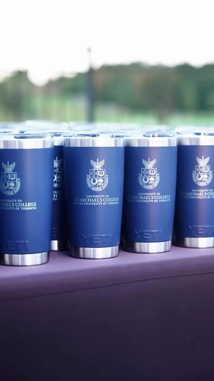 A row of finished engraved YETI tumblers