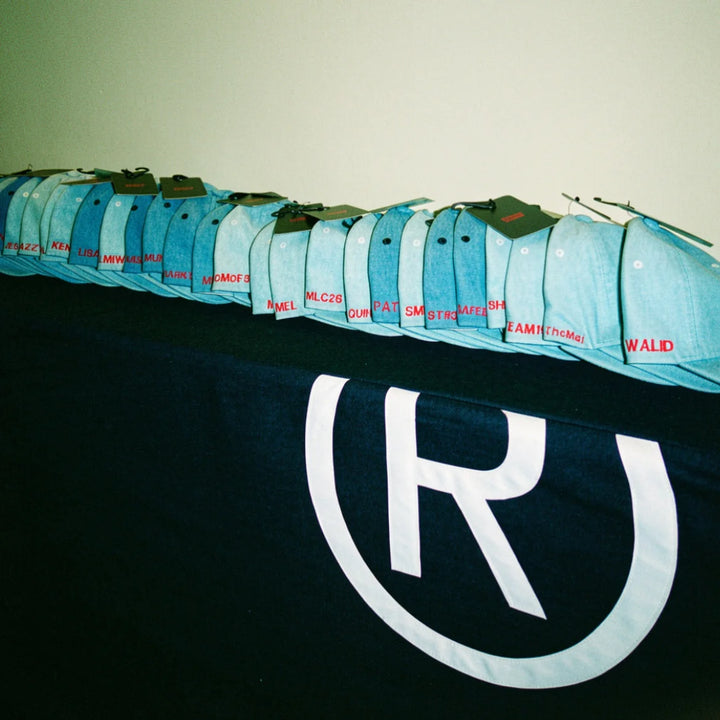 Branded hats embroidered with names at a corporate event in Calgary