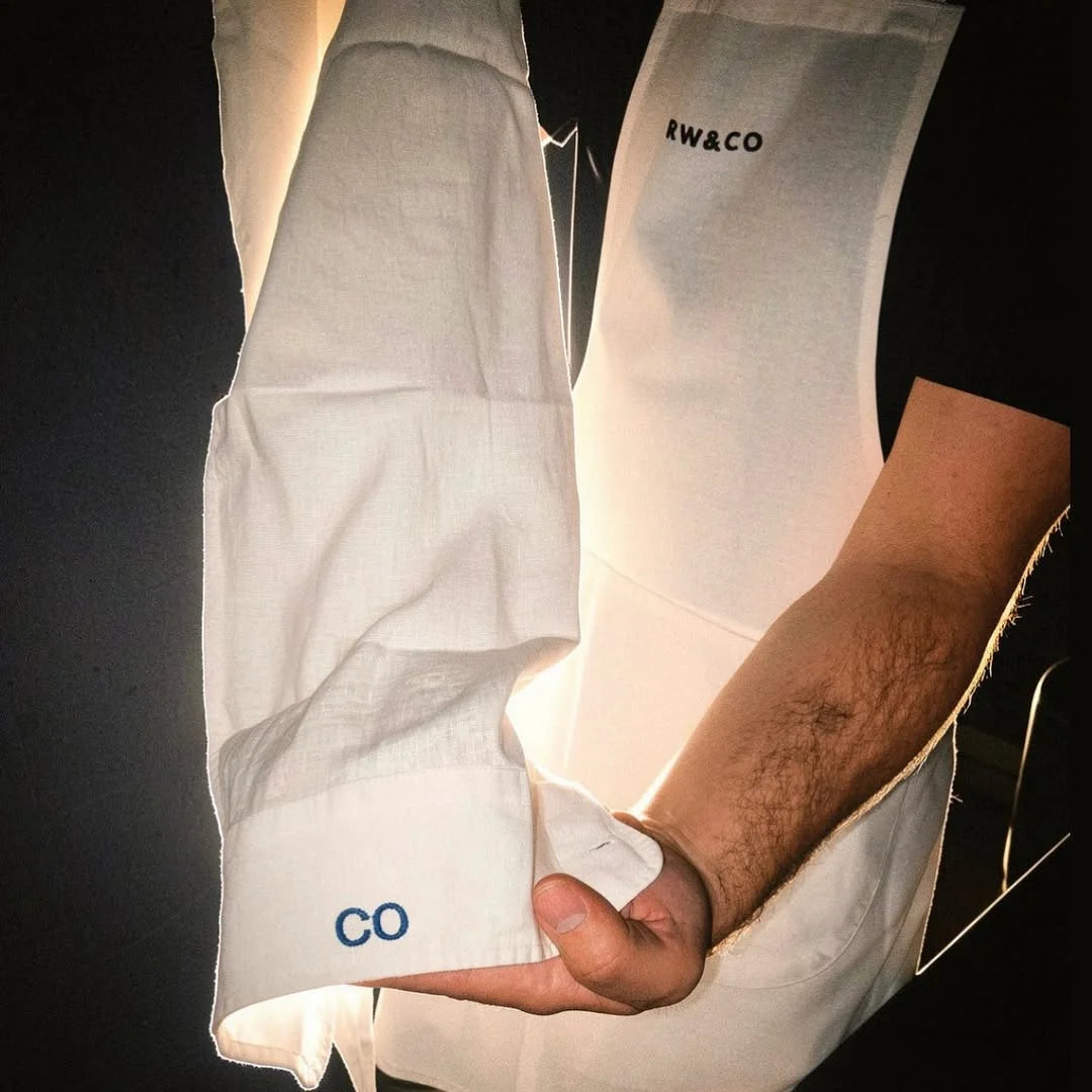 Initials being embroidered live onto a linen top at an in-store event in Toronto