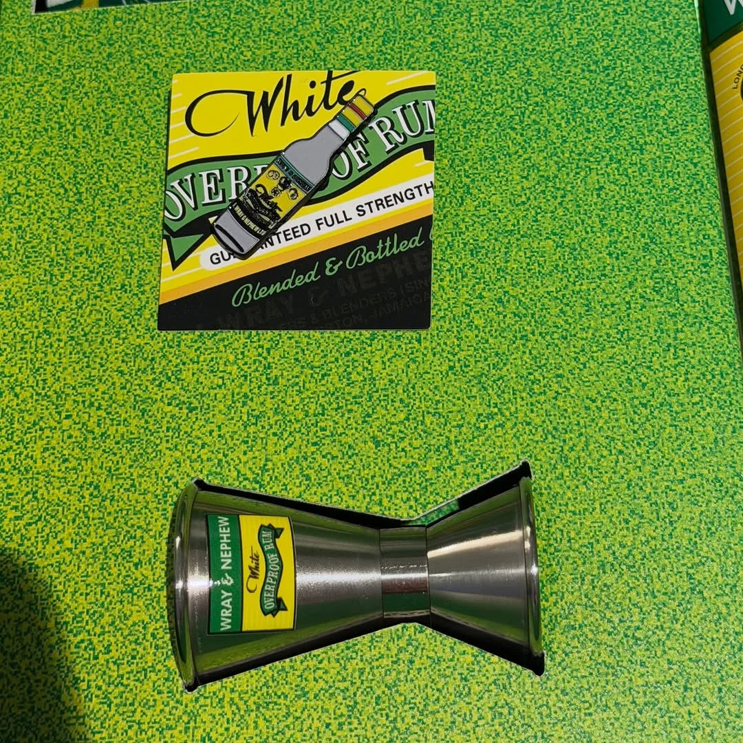 Close-up of a branded Wray & Nephew jigger