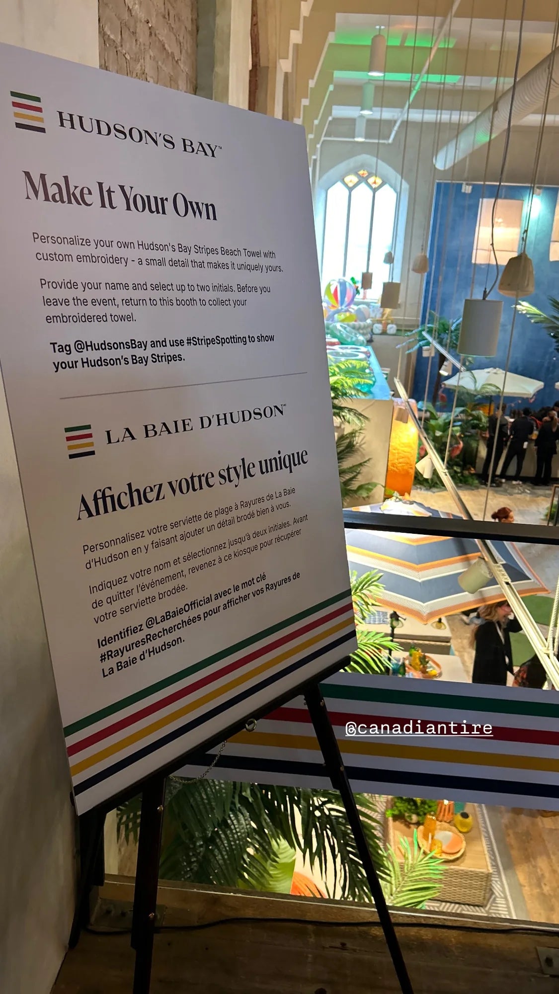 A Hudson’s Bay Make It Your Own sign beside the customization station.